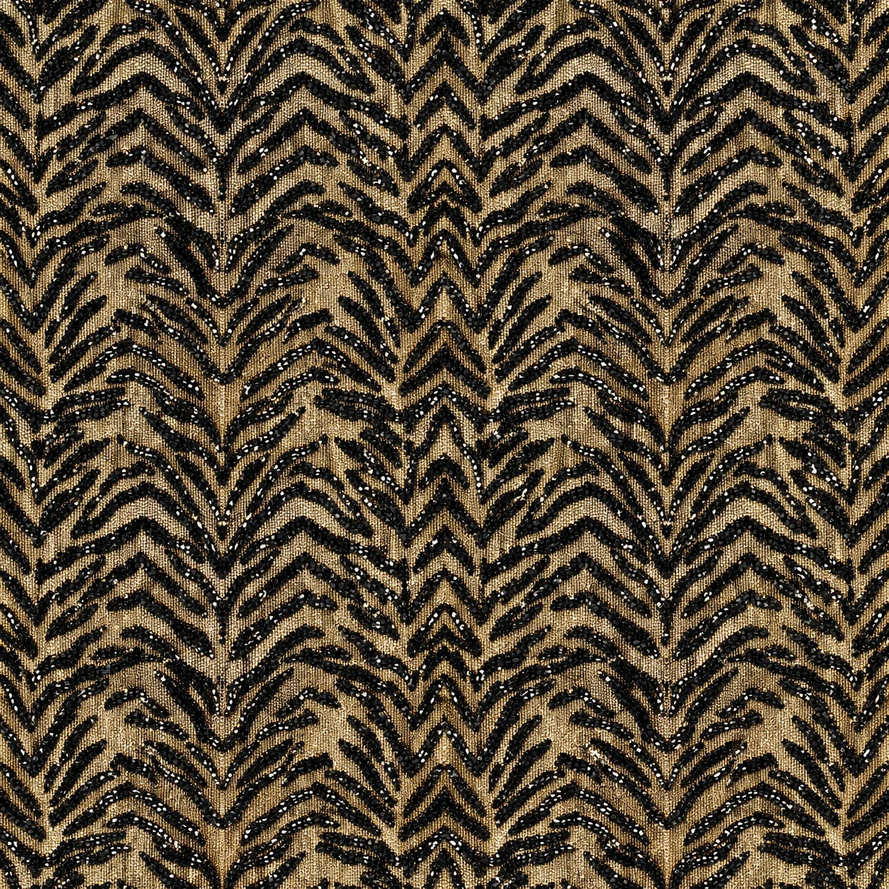 Black and tan canvas with a tiger-stripe pattern worked in raised embroidery.