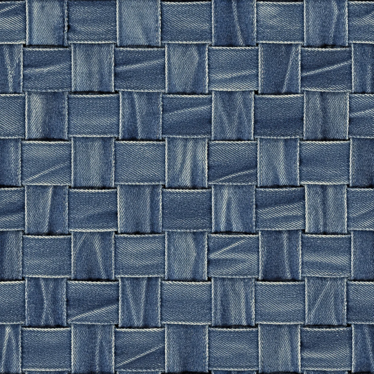 Strips of washed blue denim woven over and under in a wide basket weave.